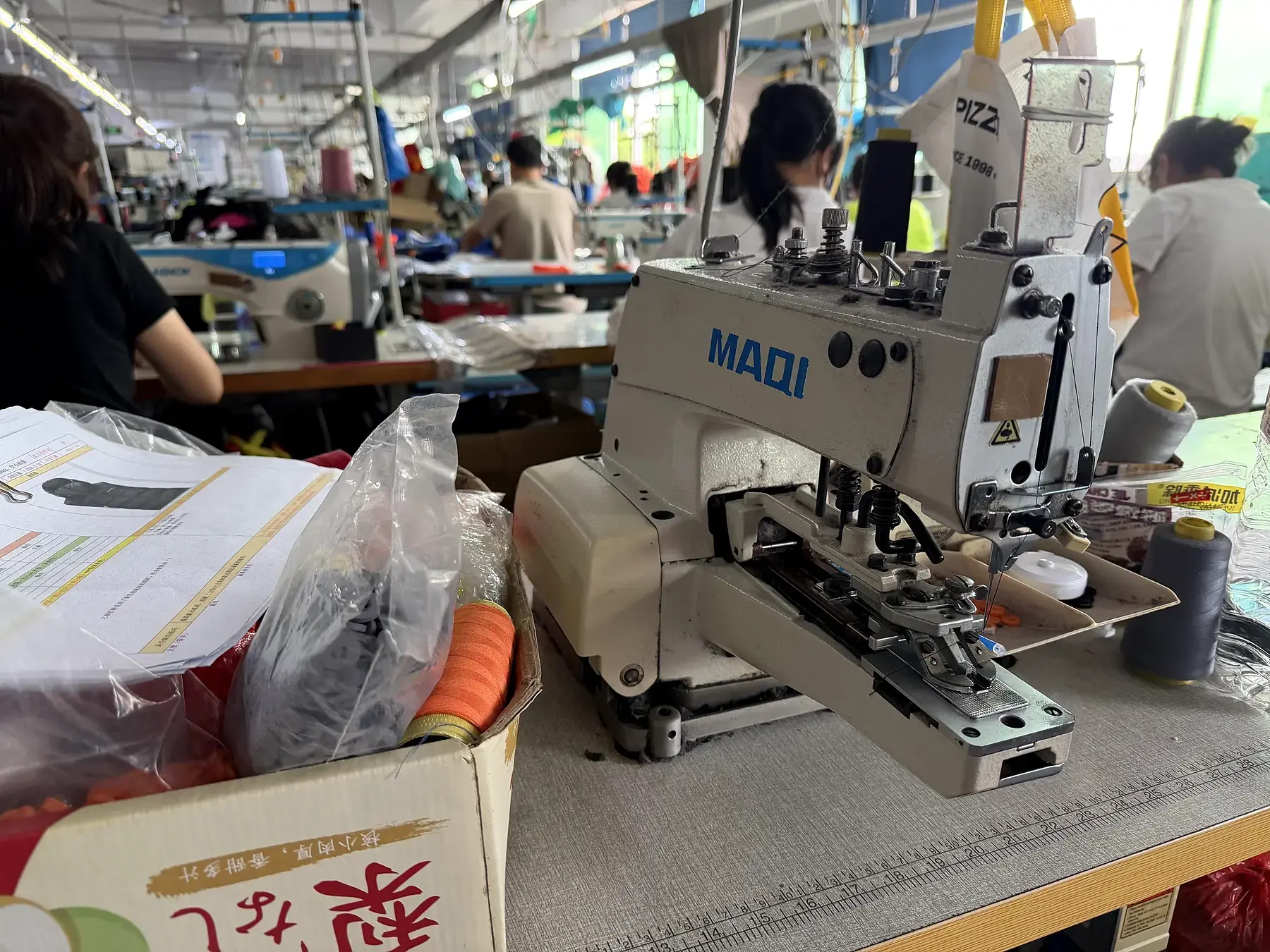 Specialized industrial sewing equipment in use